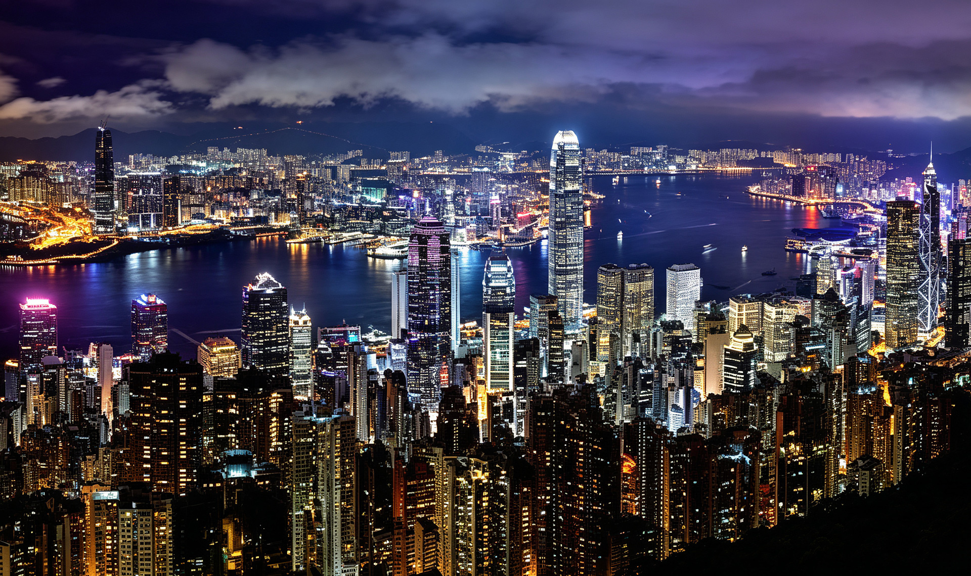Aerial view of Hong Kong skyline and Victoria Harbour at dusk