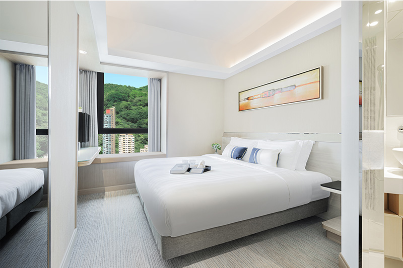 Modern deluxe twin room with wall-mounted television